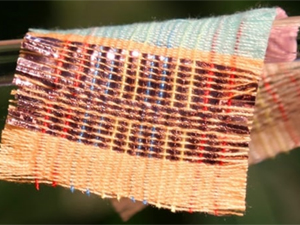 Power-generating fabric harvests energy from sunlight and movement